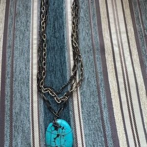 Gold tone necklace with turquoise stone